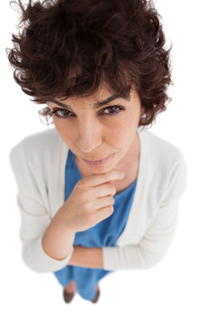 Overhead of thoughtful woman with hand touching her chin