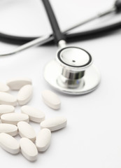 Stethoscope and pills