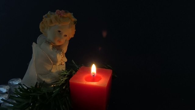 angel figurine in black background