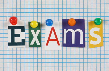 The word Exams in magazine letters on graph paper