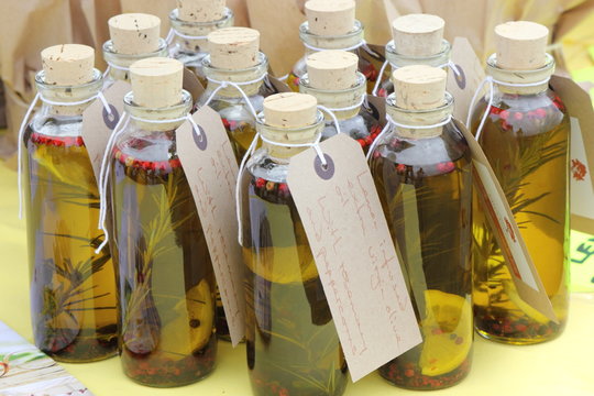 Corked bottles with herbs in oil