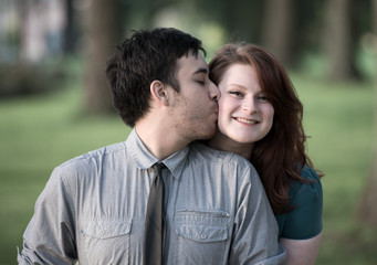 Fototapeta premium Loving young man kissing his girlfriend