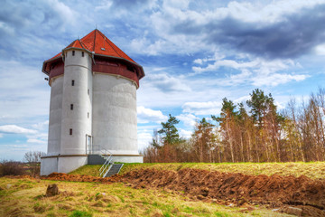 Fototapeta na wymiar White tower of hydroelectricity in Bielkowo, Poland