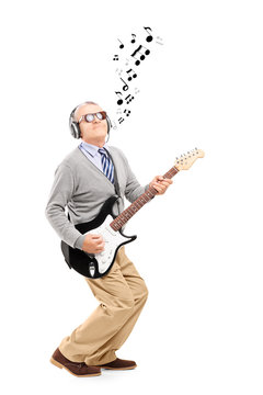 Middle Aged Man Playing Guitar And Musical Notes Around