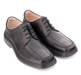 Black glossy man’s shoes with shoelaces