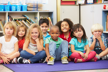 Fototapeta na wymiar Group of Elementary Pupils In Classroom