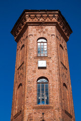 Fototapeta na wymiar The brick tower in Staraya Russa