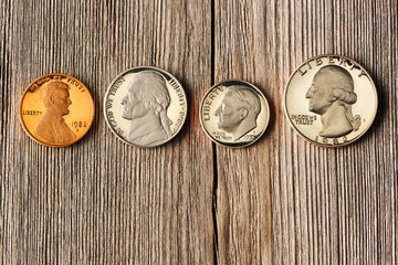 US cent coins over wooden background