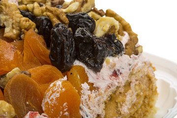 Creamy cake with dried apricot and nuts