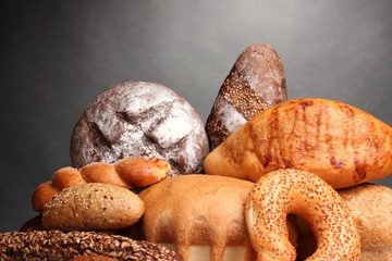 delicious bread on wooden table on gray background
