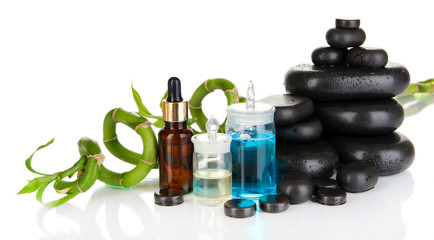 Spas composition with oils and spa stones isolated on white