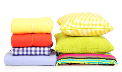 Bright pillows and plaids, isolated on white