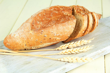 Hot tasty bread, on cutting board, close up