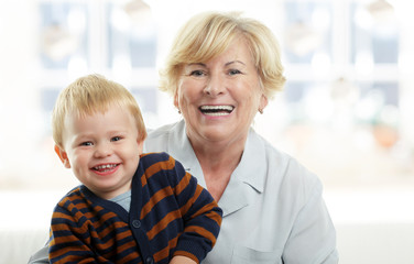 Smiling young boy and his grandmother