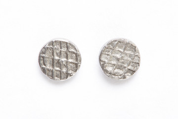 Metal nail heads on white, clipping path