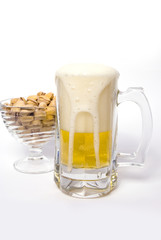 Pint of Beer and Pistachios isolated on white