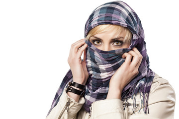 serious girl with a scarf over her face