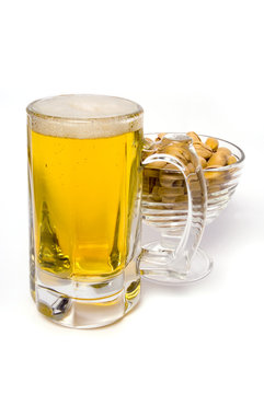 Pint of Beer and Pistachios isolated on white