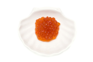 Red Caviar in shell saucer isolated on white