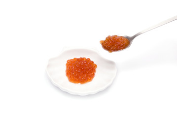 Red Caviar in saucer and spoon isolated on white