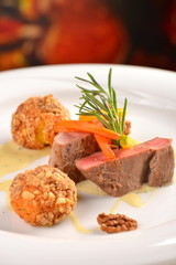 Roasted fillet mignon, with herbs, carrot, walnut and potato