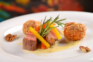 Roasted fillet mignon, with herbs, carrot, walnut and potato