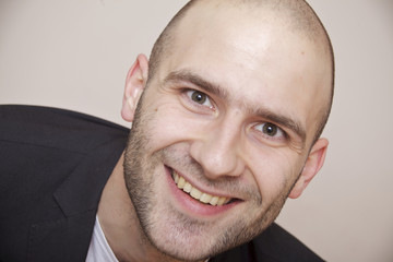 fashion shot of an elegant young man wearing suit