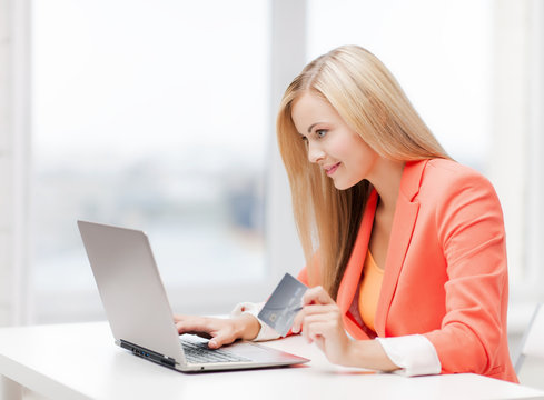 businesswoman with laptop and credit card