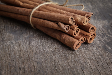 cinnamon sticks on old wooden table