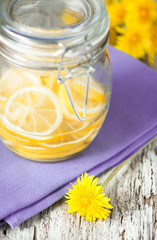 Obraz na płótnie Canvas Slices of lemons in the glass jar