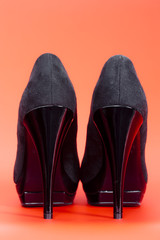 back view of black pumps