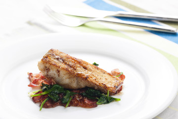 tilapia fillet with warm spinach and bacon salad