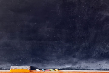 Blank blackboard with colored chalks - obrazy, fototapety, plakaty