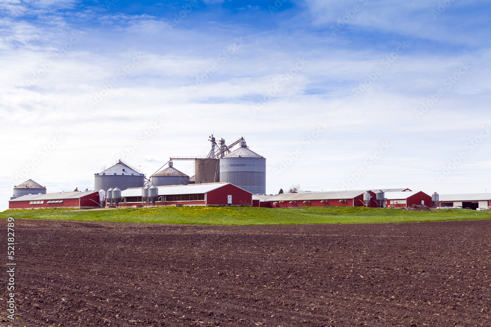 Wall mural Big Industrial Farm With Cloudy Sky