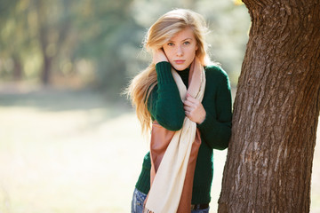 Beautiful young woman in autumn park