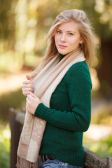 Beautiful young woman in autumn park