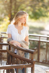 Beautiful young woman in autumn park