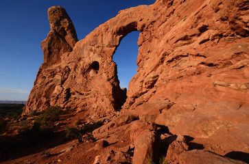 Hiker Exploring the Turret Arch