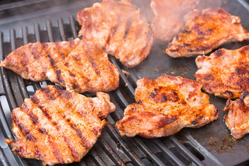 Pork meat grilled on barbecue