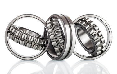 Composition of steel ball roller bearings  on white background