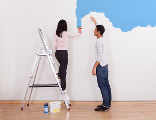 Couple Painting The Wall