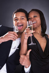 African Couple Enjoying Champagne Drink
