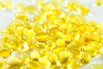 Group capsules of fish oil white background