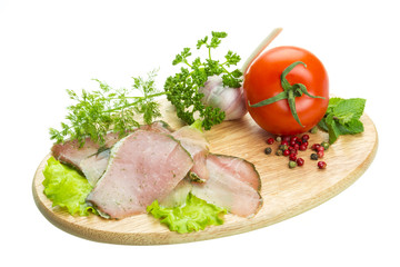 Ripe fresh ham with vegetables