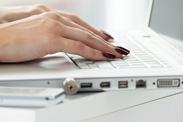 closeup business woman typing using laptop PC