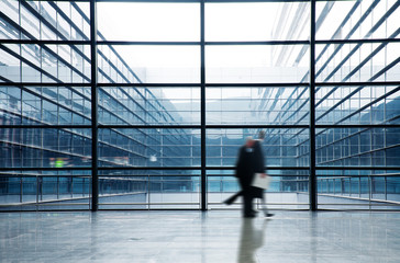 people silhouette in hall of office building