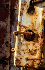 Old detail of keyhole on rusty nails