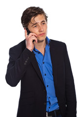 Young business man calling with cellphone wearing blue jacket. I