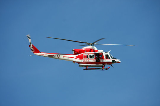 patrol helicopter of firefighters in blue sky over a fire 9