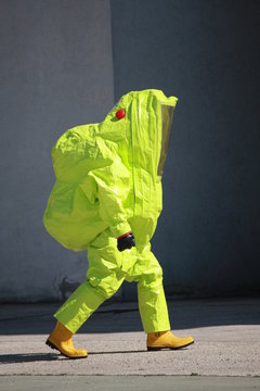 Fireman with a suit for protection from the risk of biological a